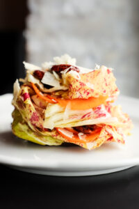 Radicchio & Persimmon Insalate | castelfranco lettuce, candied pecans, & cranberry walnut croutons